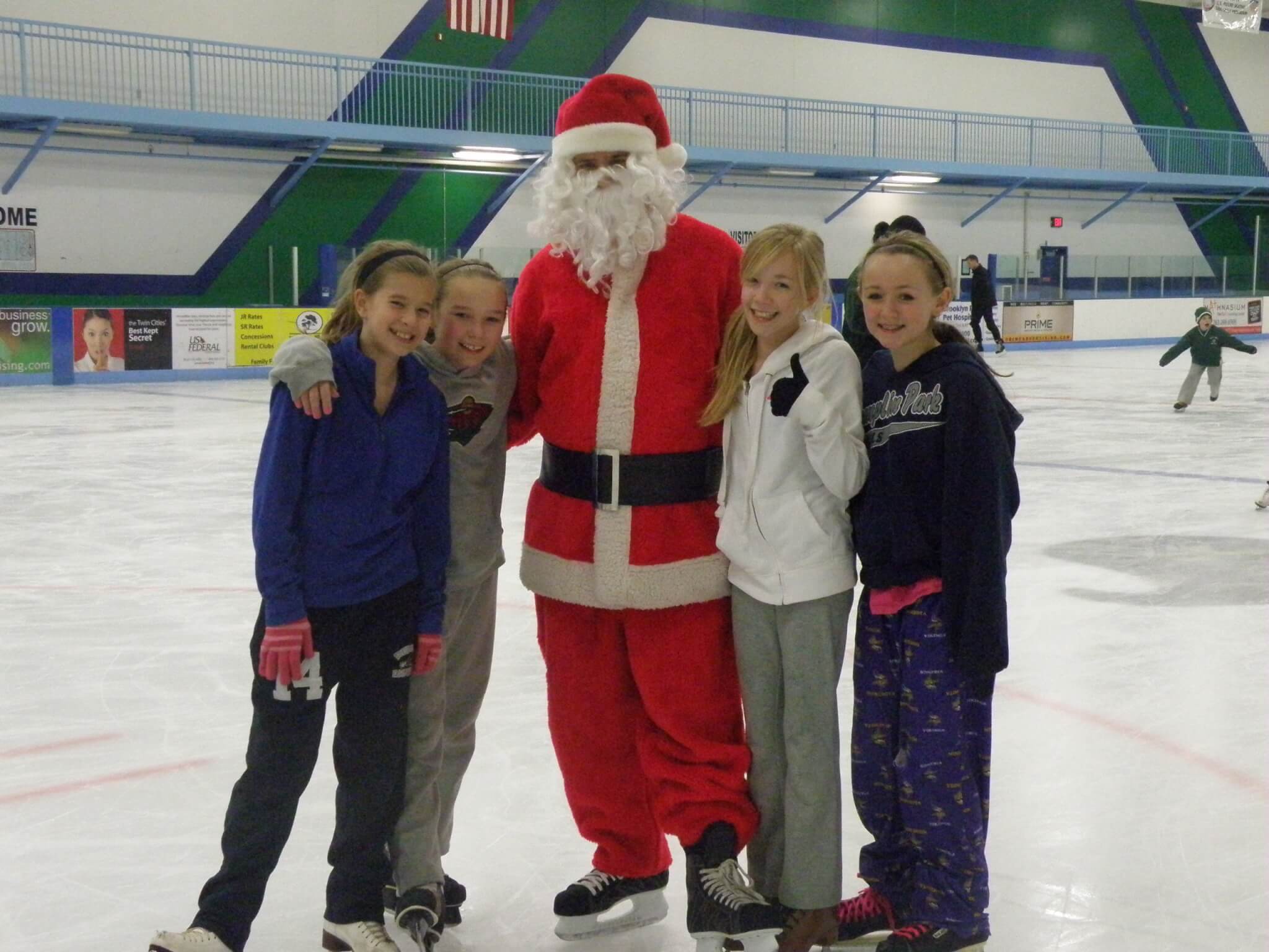 Kids ice skating with Santa Claus