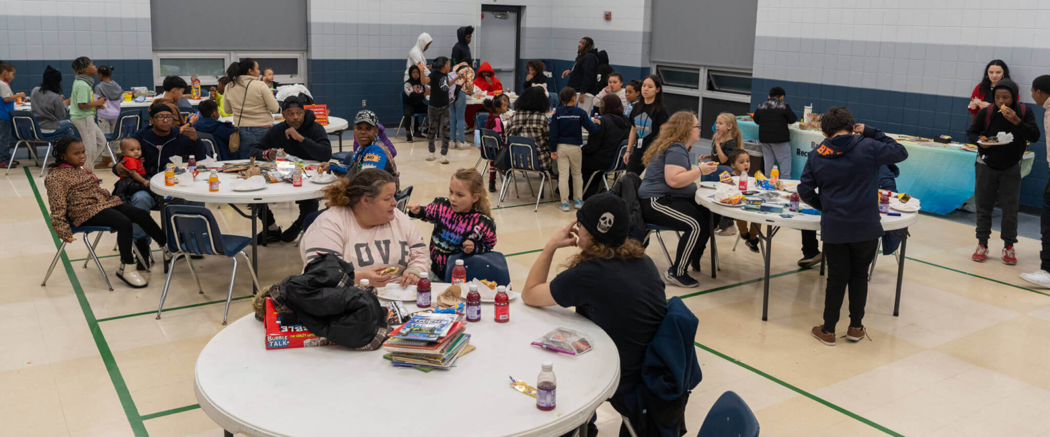 Youth and Adults enjoying games and activities in a gym